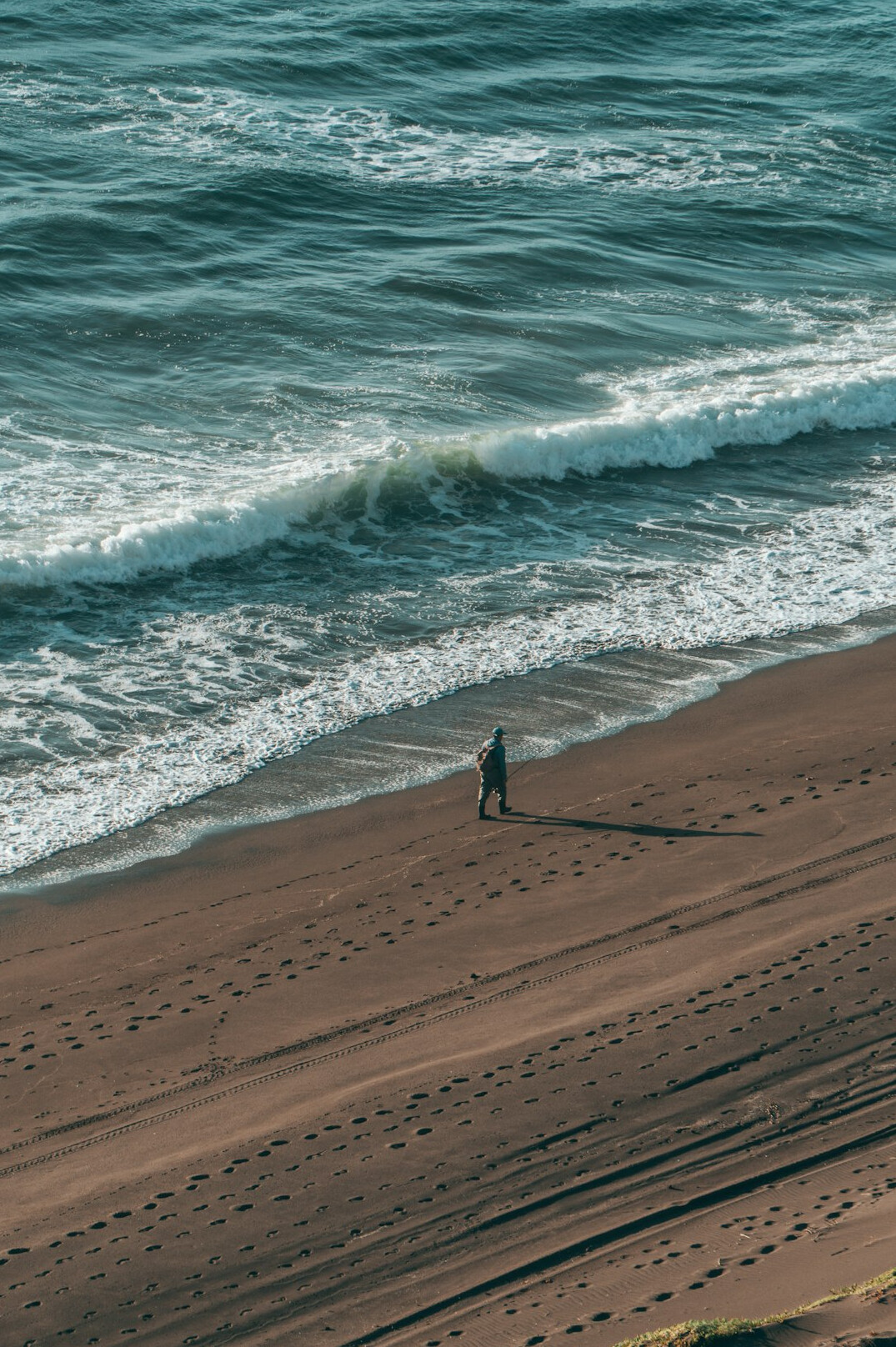 Older Chilean fisherman standing near the coast