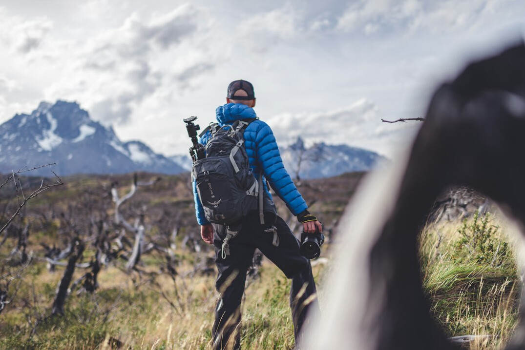 Portrait of a Chilean documentary photographer holding a camera